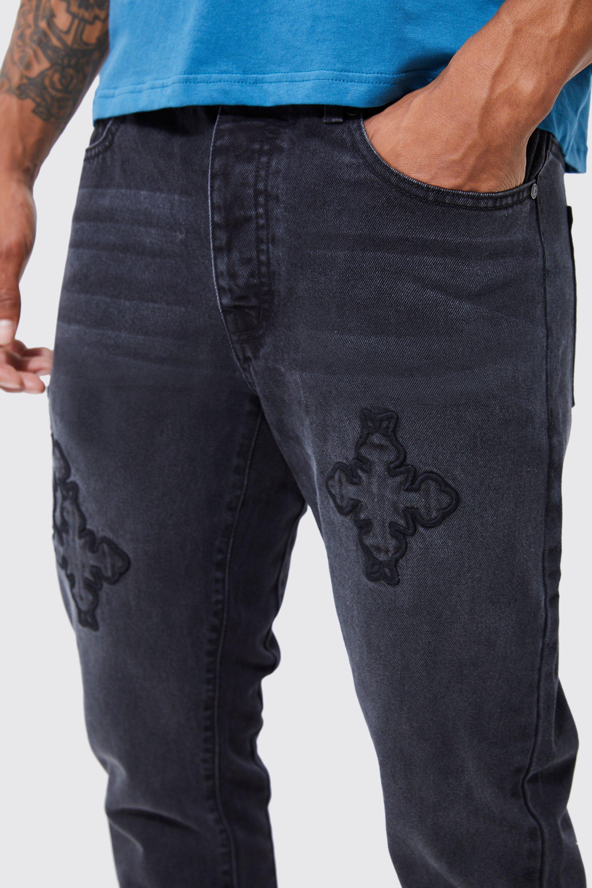 Jeans with cross outlet on back pocket mens